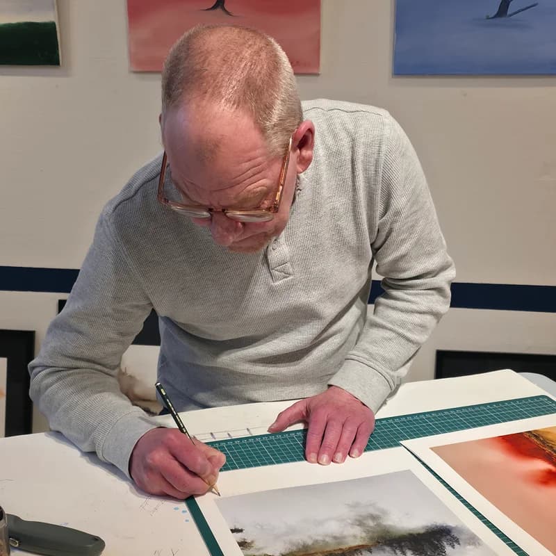 Signing Gicclée prints,