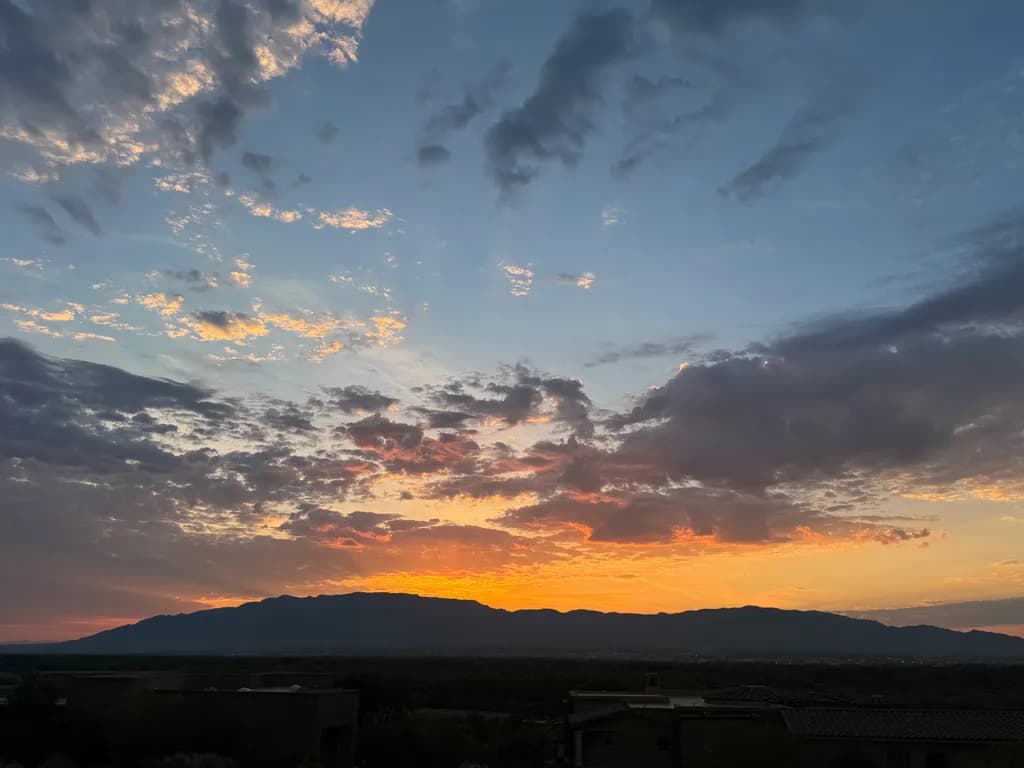 Whispers of Dusk: A Serene Sunset Over Majestic Mountains