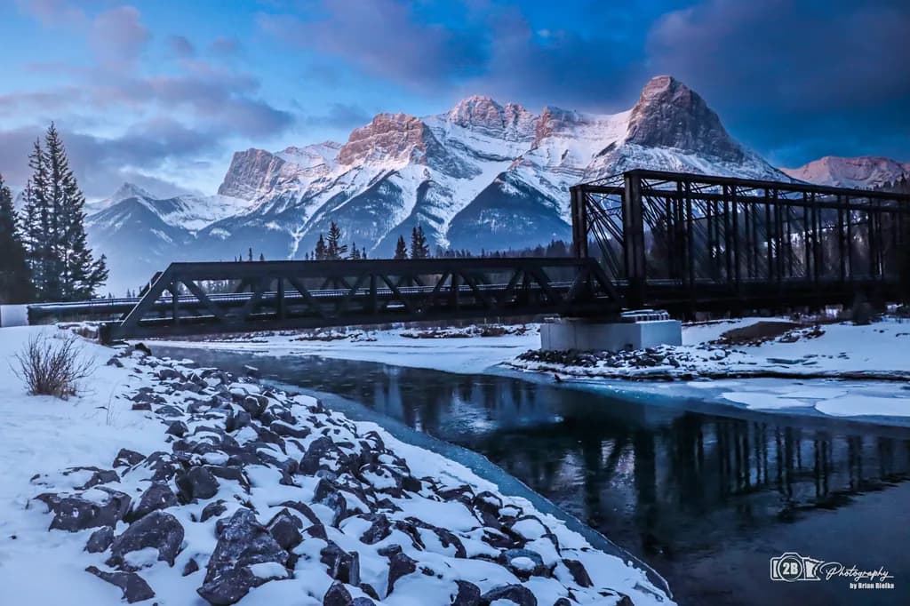 Whispers of Winter: A Bridge to the Majestic Peaks Beyond