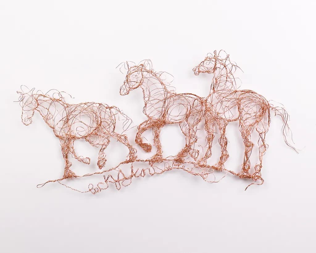 "Graceful Gallop: Copper Wire Horses in Motion"