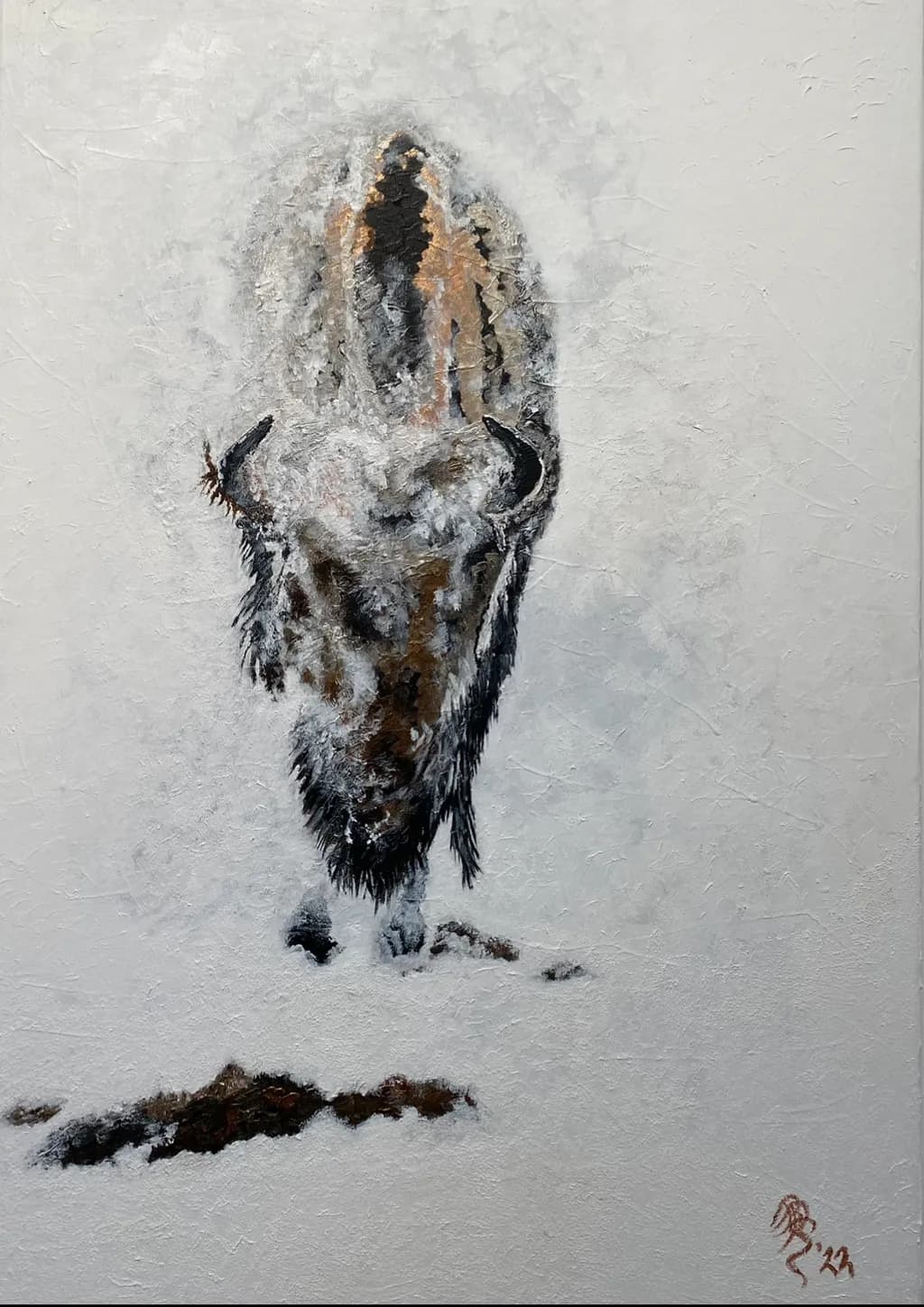 Bison appearing from within the fog.