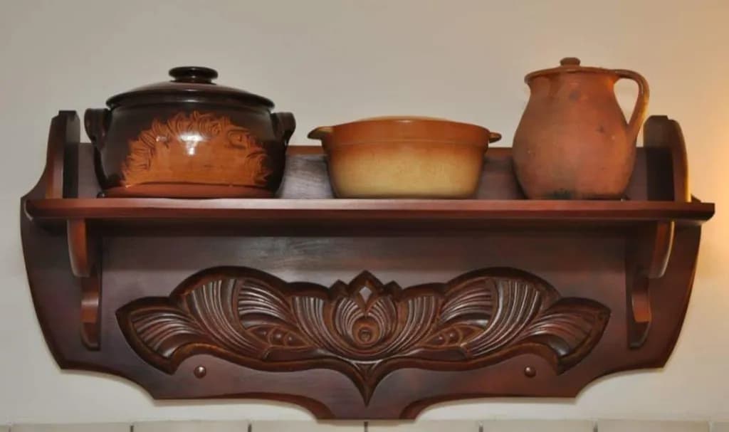 Carved Wooden Shelf with Pottery
