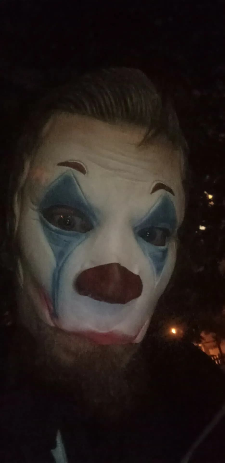 Whispers of the Night: A Haunting Clown Portrait