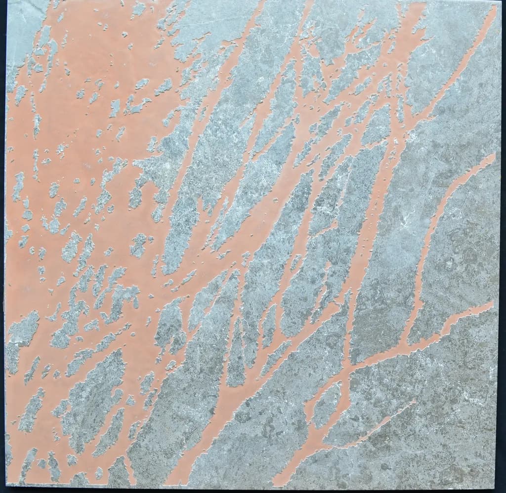 Laser engraving on a ceramic floor tile. 2019