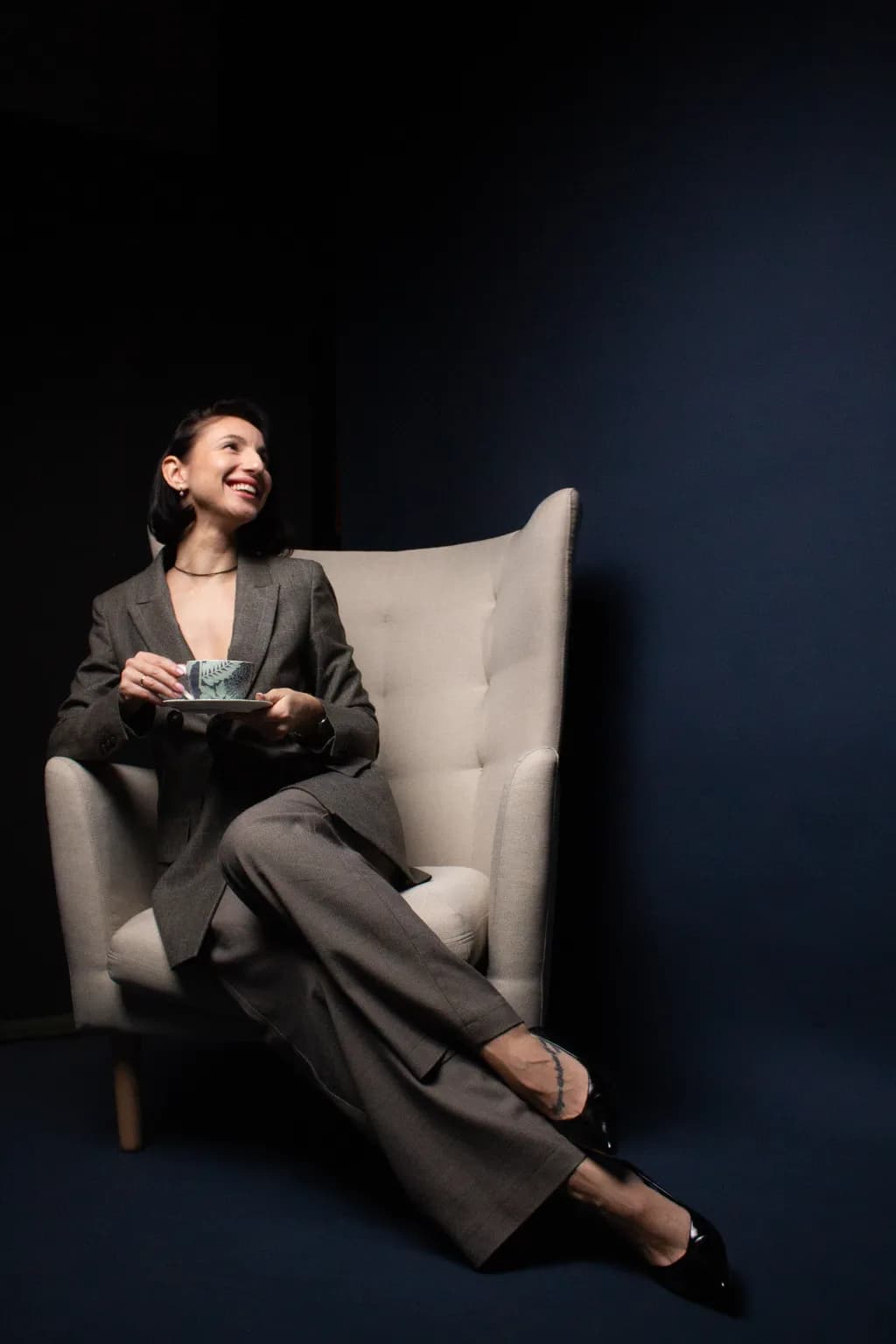 Woman in Chair with Teacup