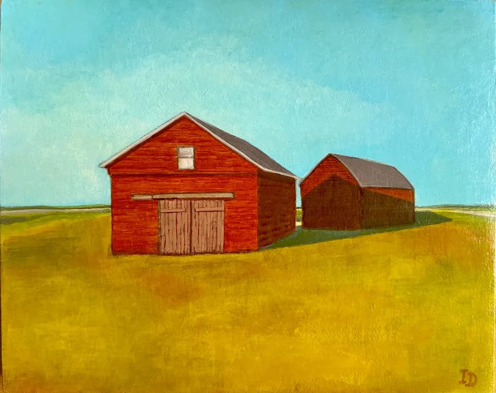 Rustic Harmony: A Serene Landscape of Red Barns Under a Vast Sky