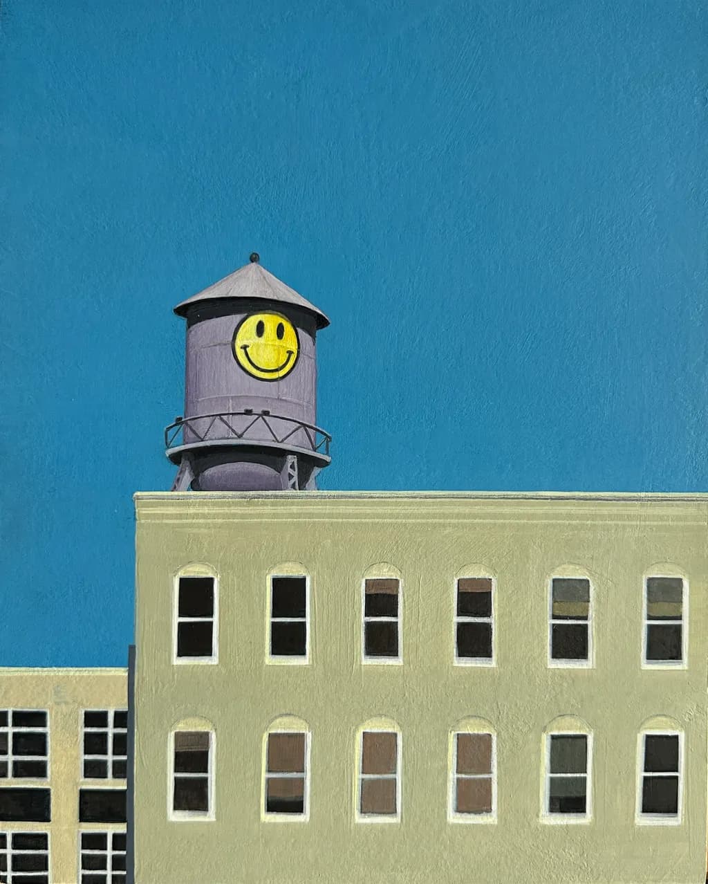 Whimsical Waters: The Cheerful Water Tower Against a Bright Blue Sky