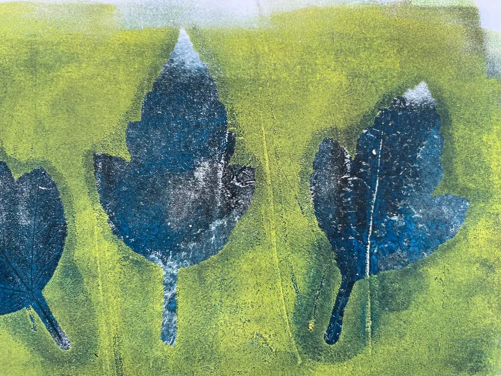 Blue Leaf Trio on Green Background