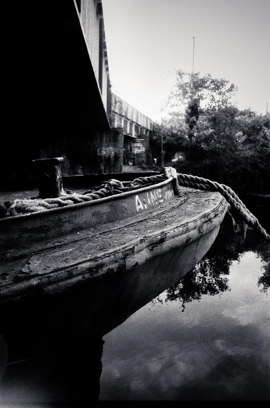 Rusted Boat Near Bridge