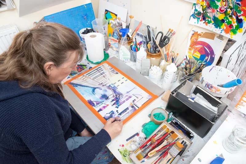 Working on a painting on paper