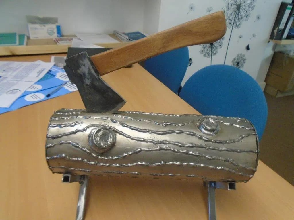 Metal Log and Axe Sculpture