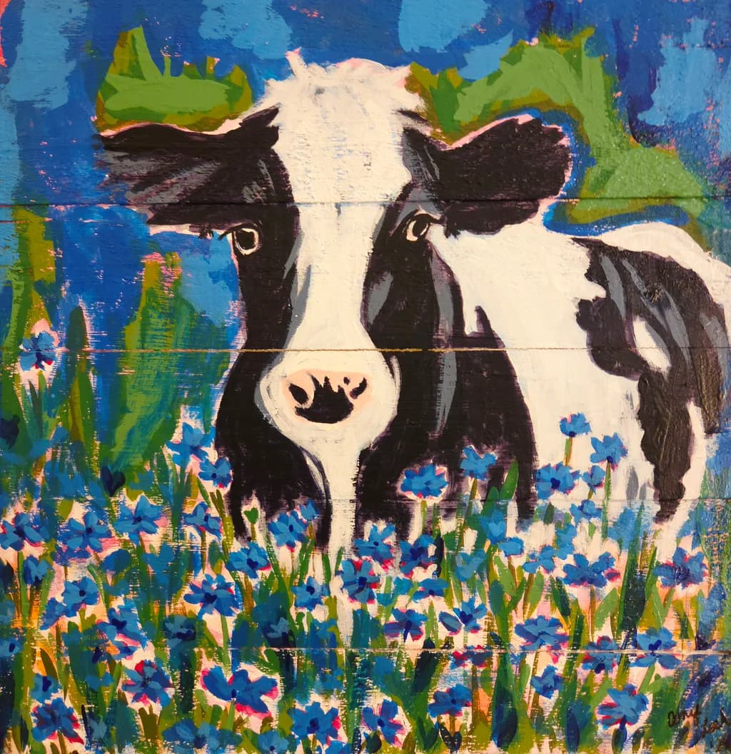 Cow Among Blue Blooms