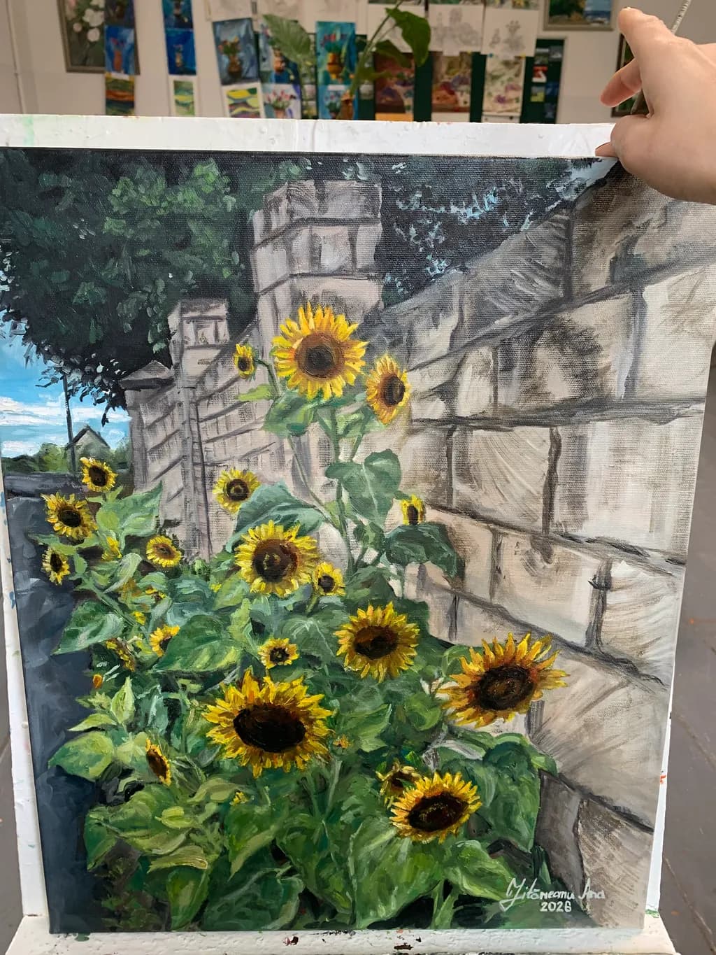 Sunflowers by the Wall