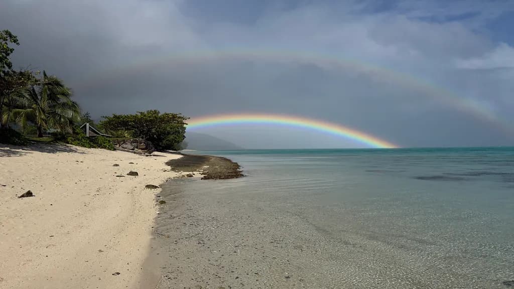 Twin Rainbows Over Shoreline