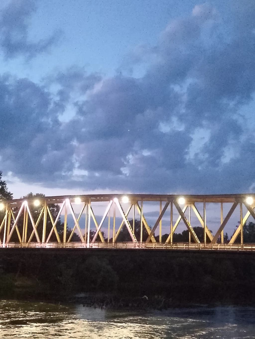 Illuminated Bridge Over River