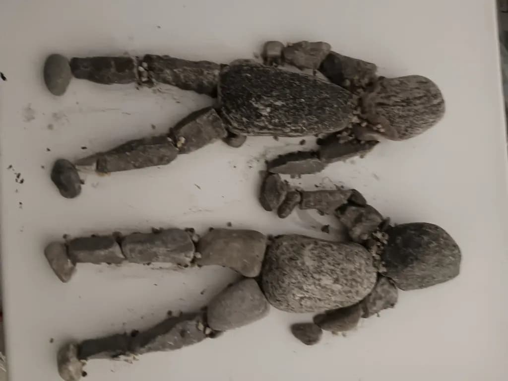 Stone Figures Embrace
