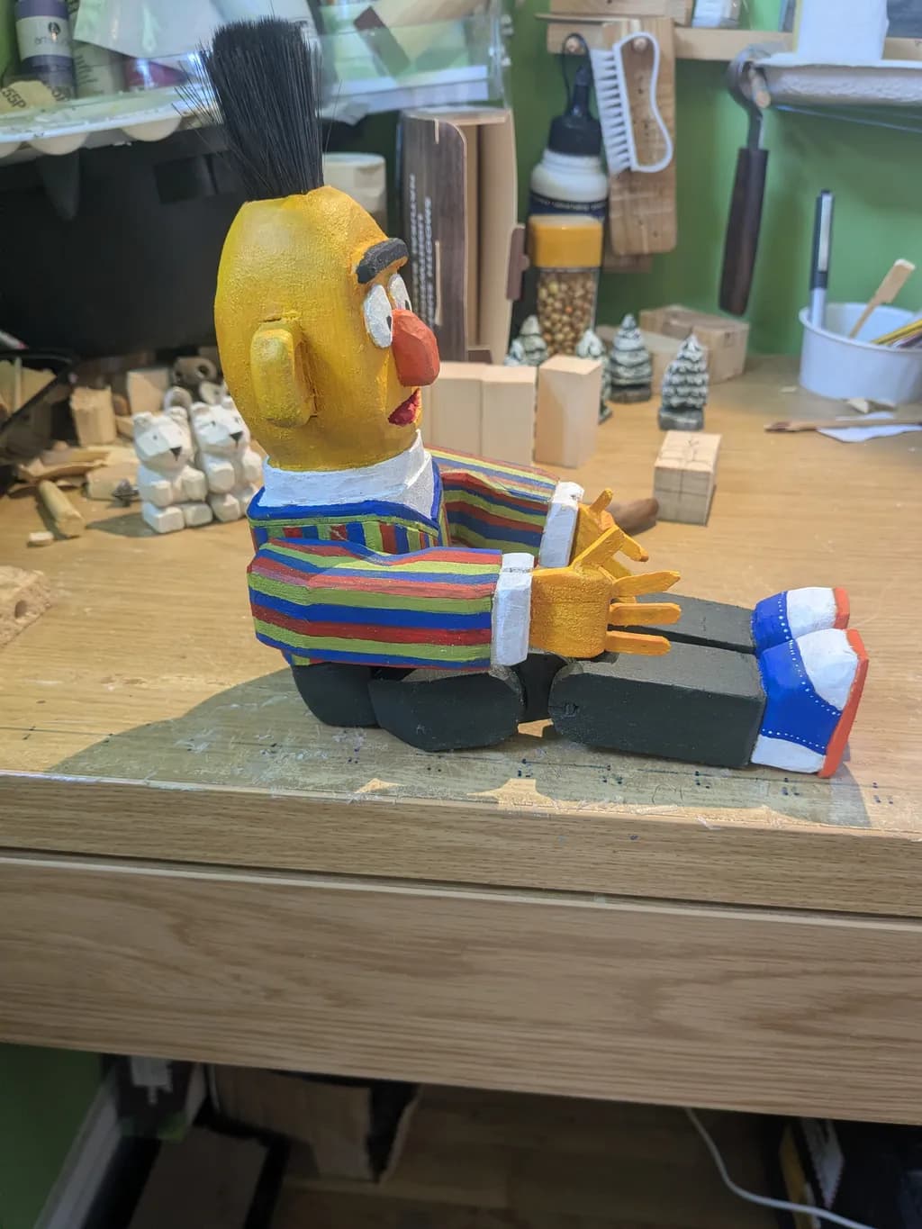 Wooden Figurine in Striped Shirt