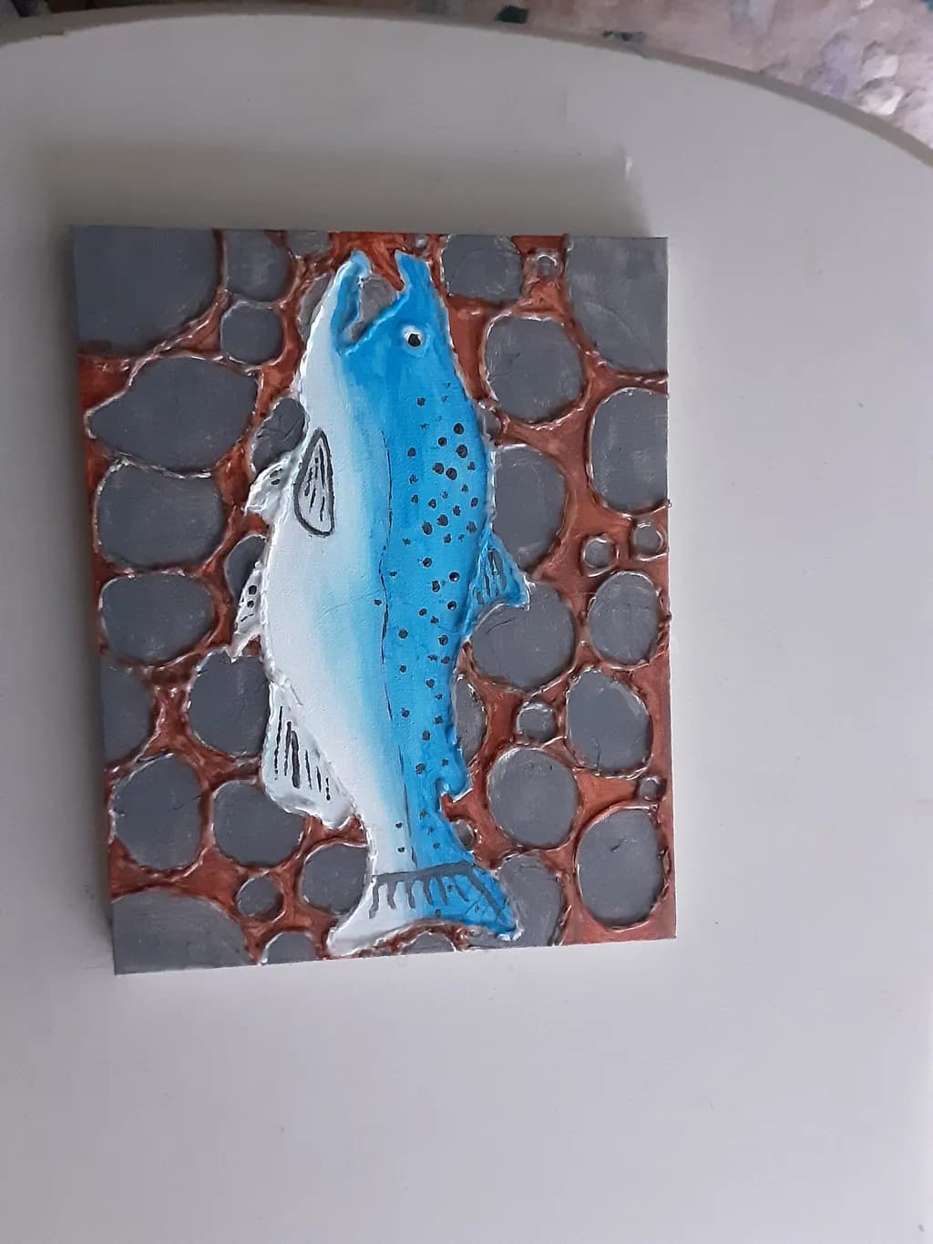 Blue Trout on River Rocks