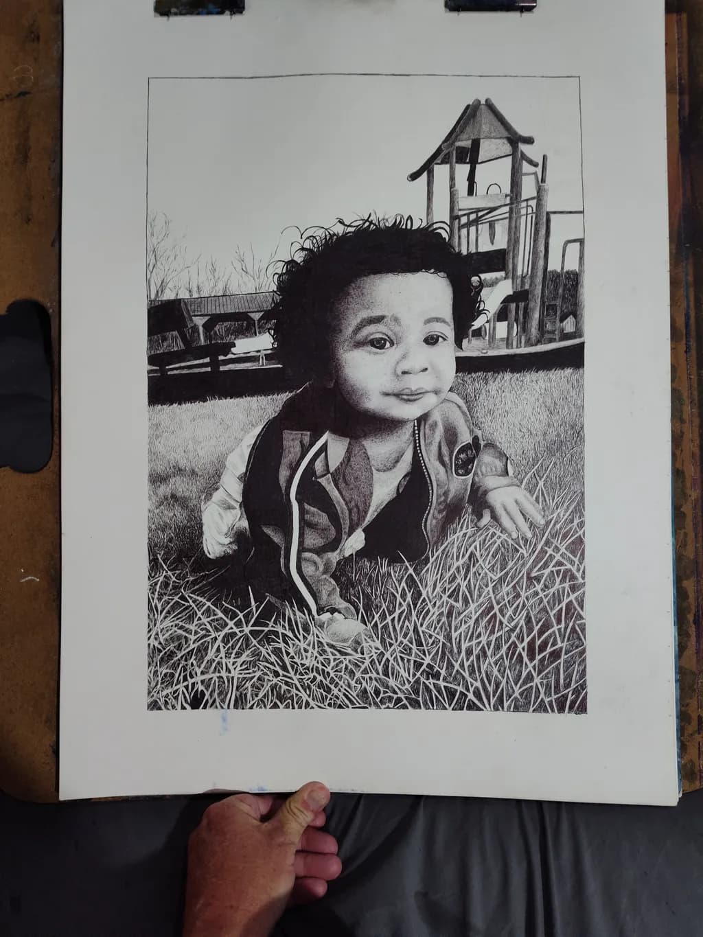 Child in Grass at Playground