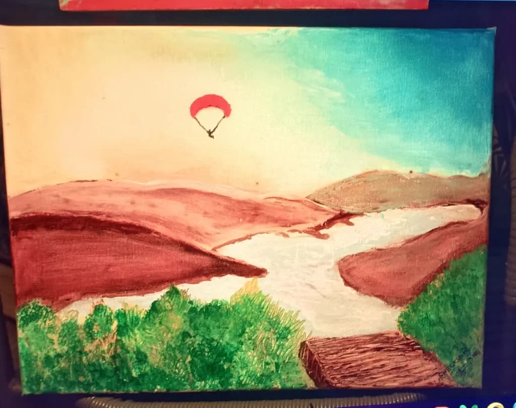 Paraglider Over River Hills