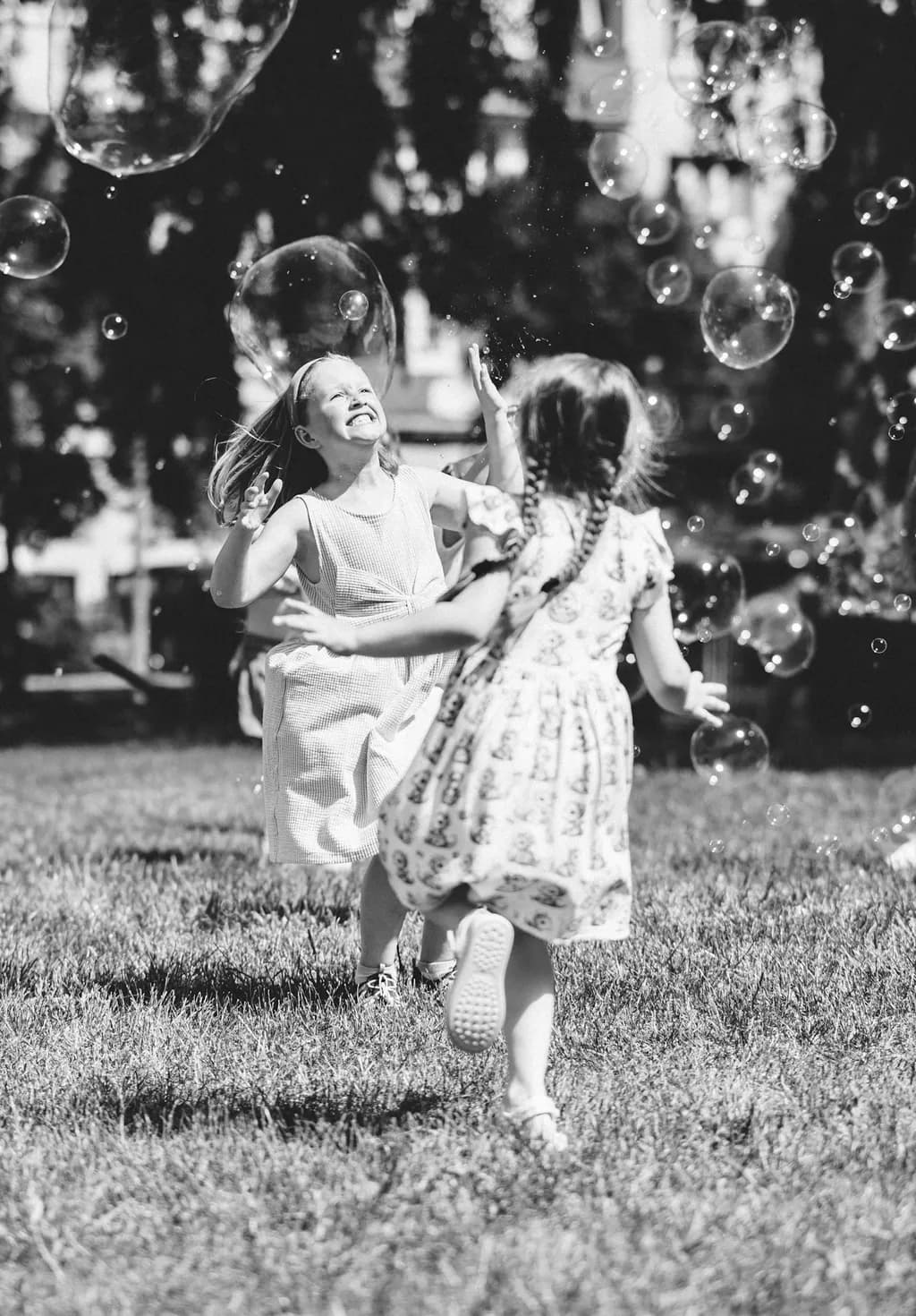 Children Chasing Bubbles