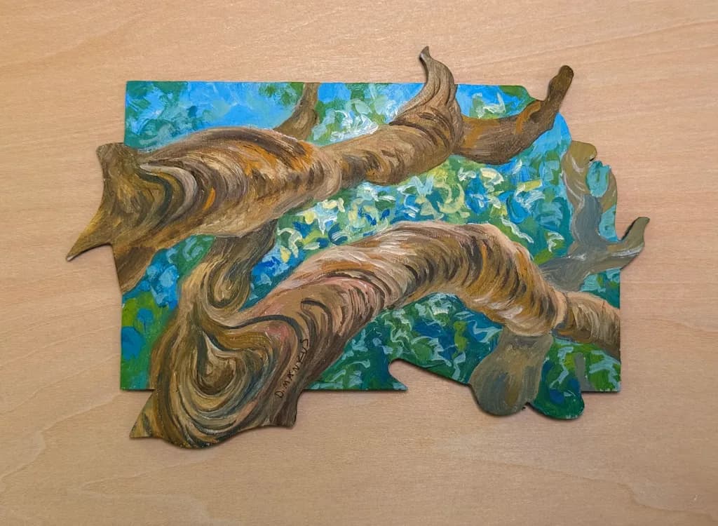 Textured Branches Under Leaves and Sky