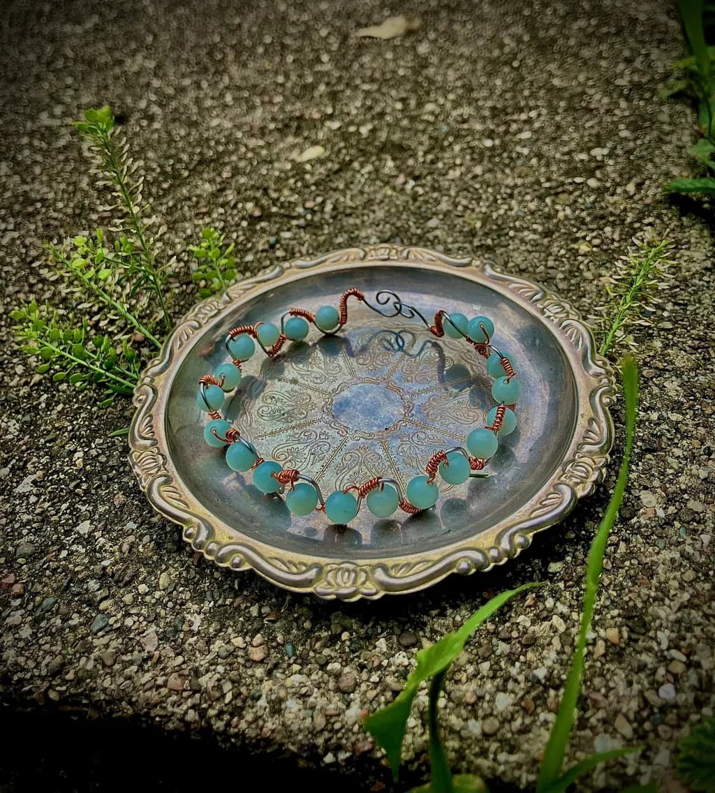 Copper Bead Bracelet on Plate