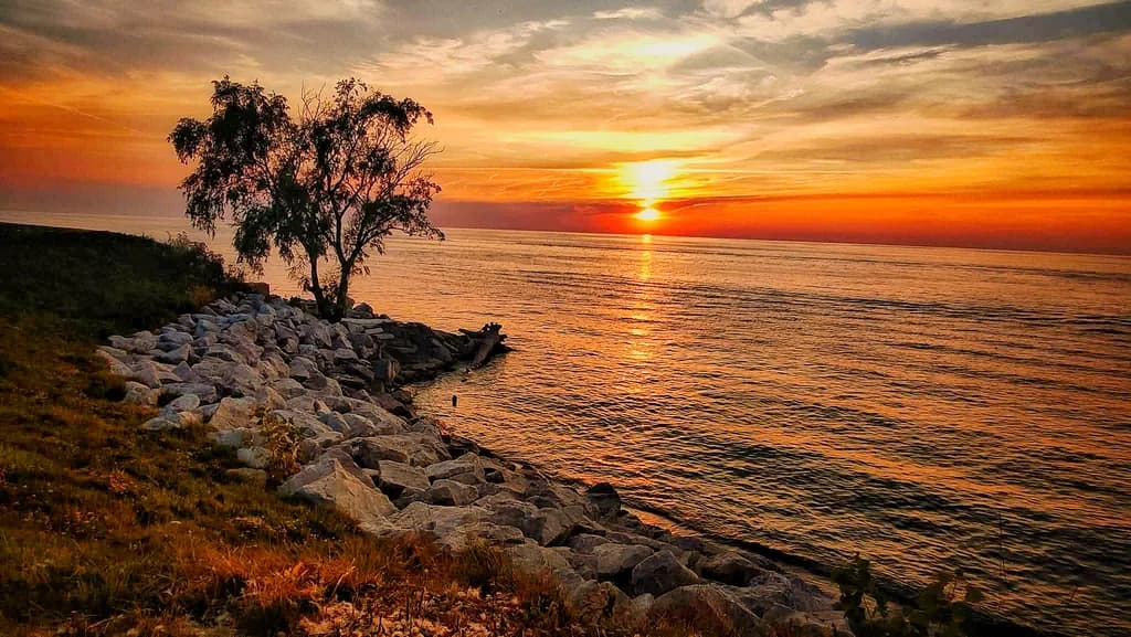 Sunset Over Lake Shore Rocks