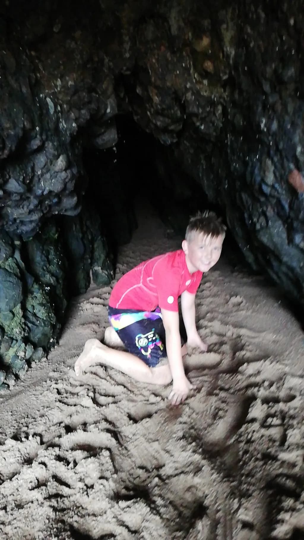 Boy in Rocky Cave Sand