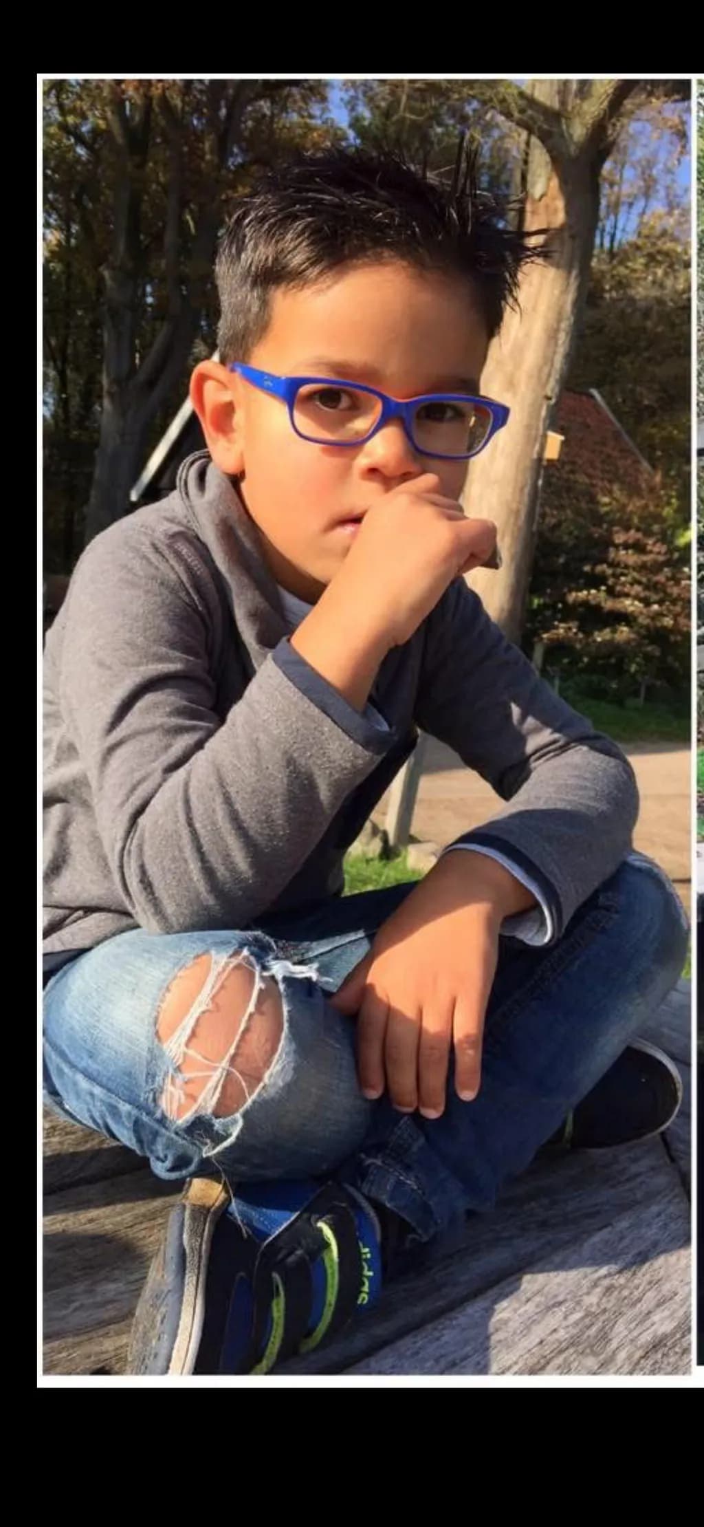 Boy in Blue Glasses