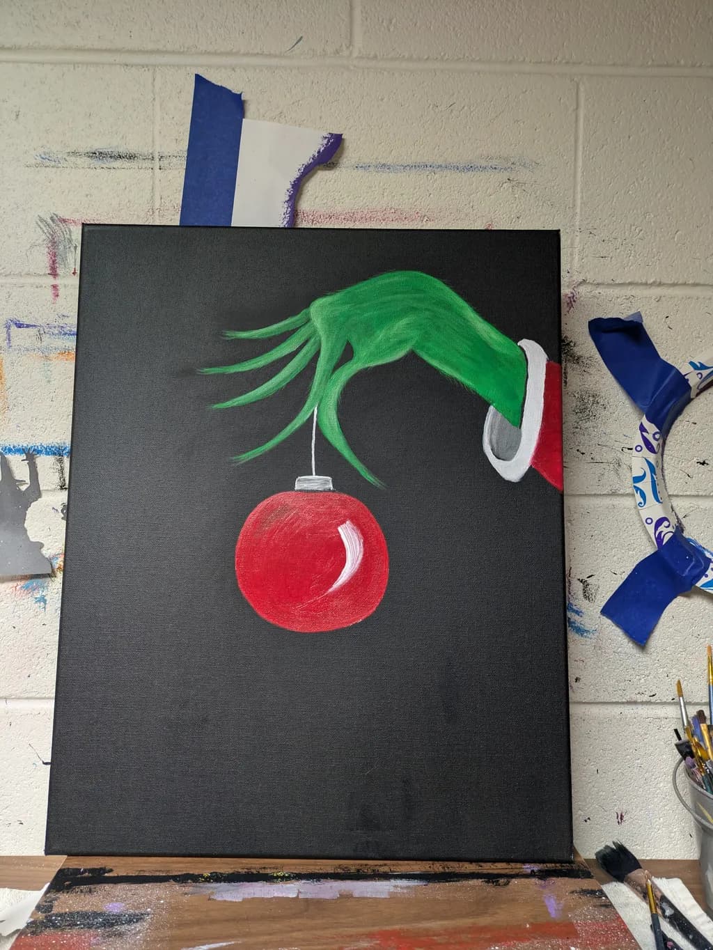 Green Hand with Red Ornament
