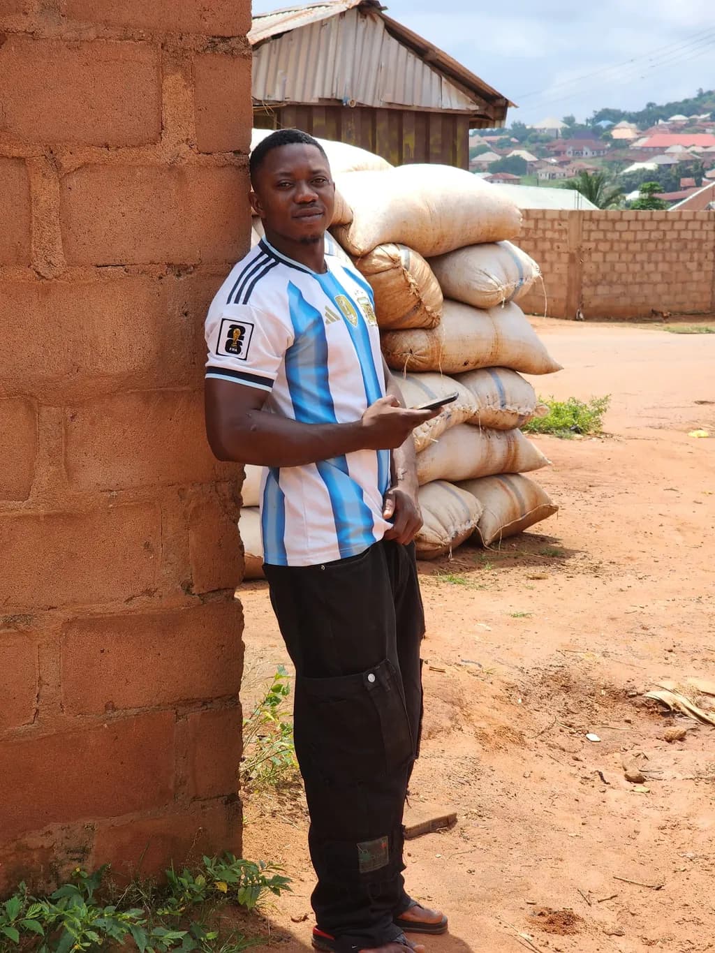 Man Leaning by Sacks