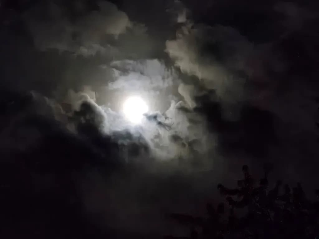 Moon Through Storm Clouds