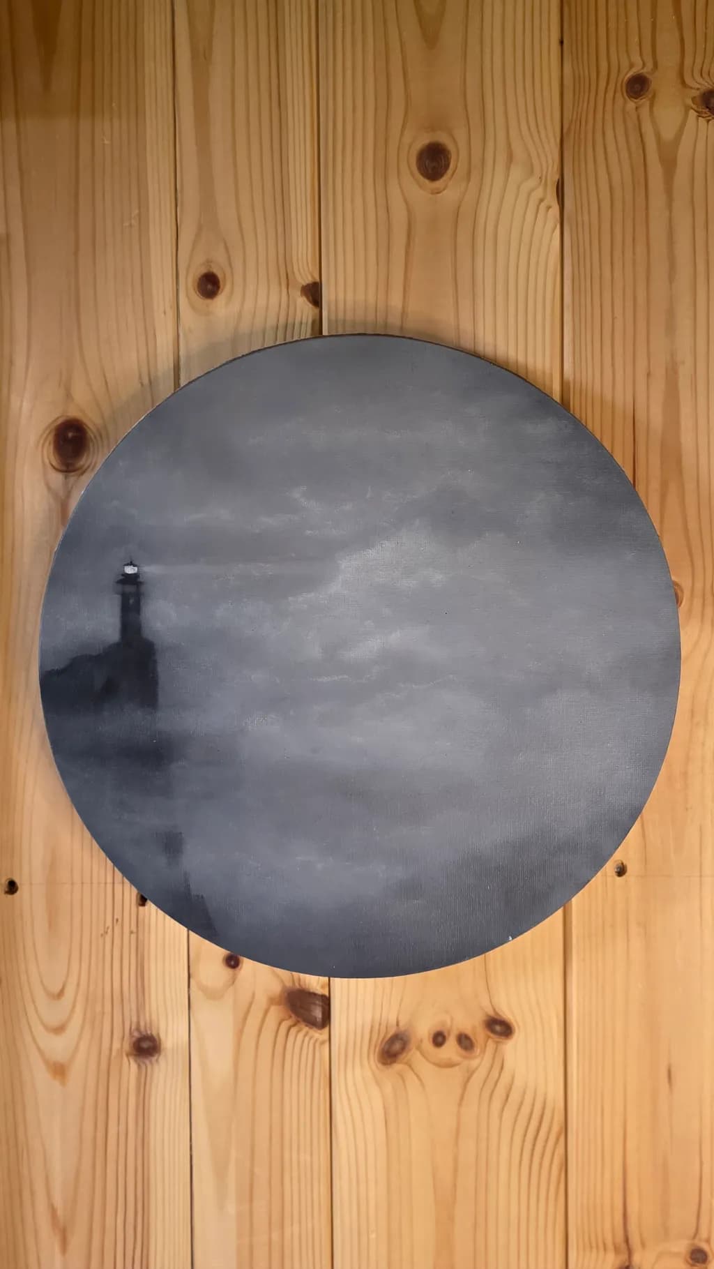 Lighthouse Under Clouded Skies