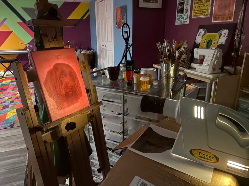 Projecting an image onto a painted canvas to sketch large sketch large areas.