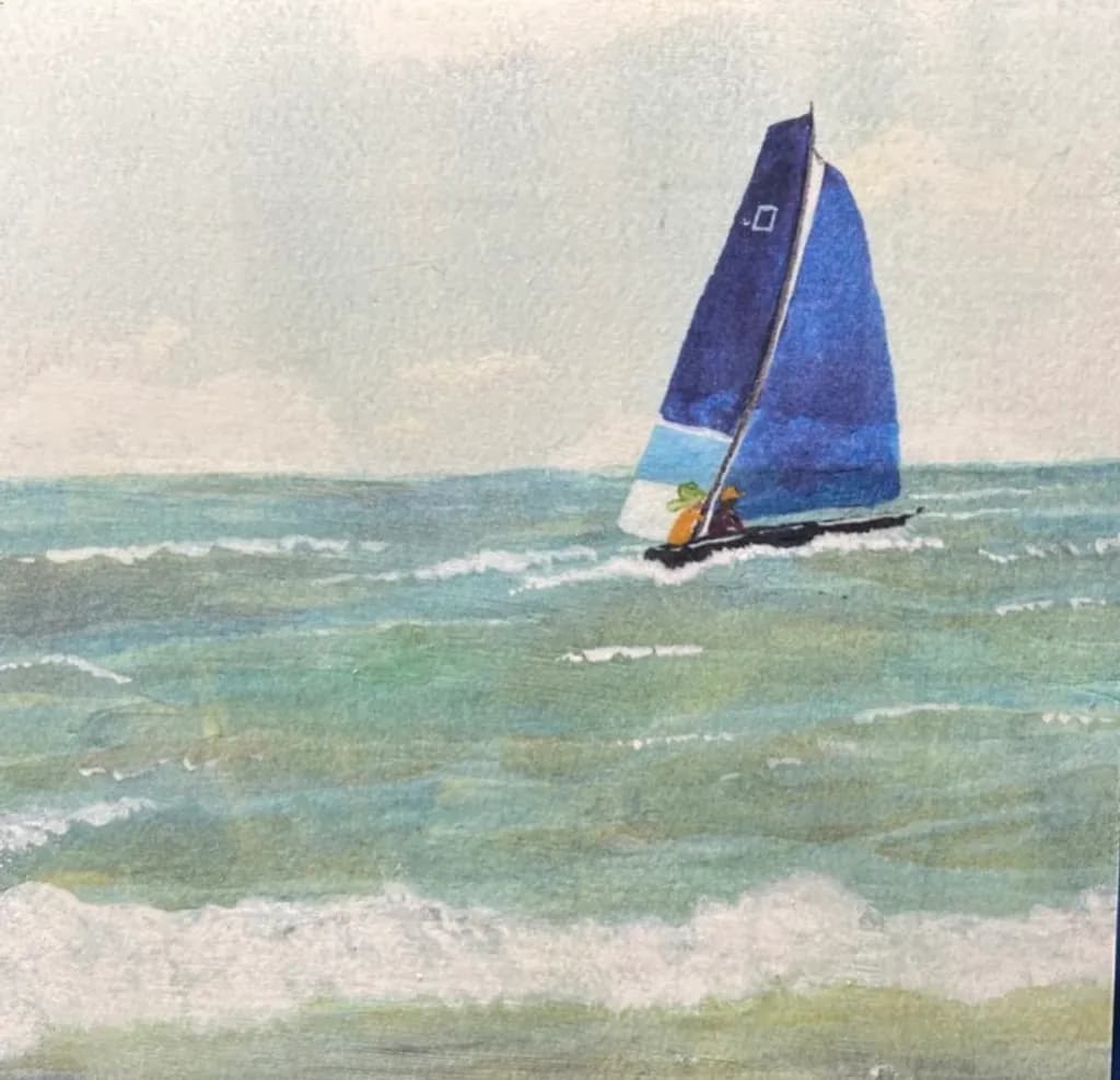 Blue Sailboat at Sea