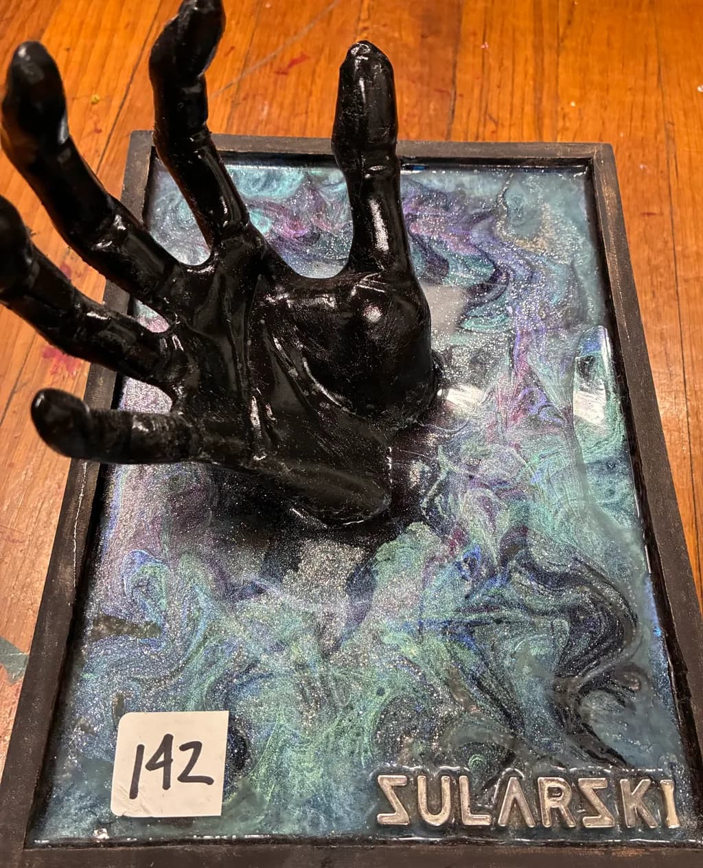 Shadow Hand in Cosmic Resin