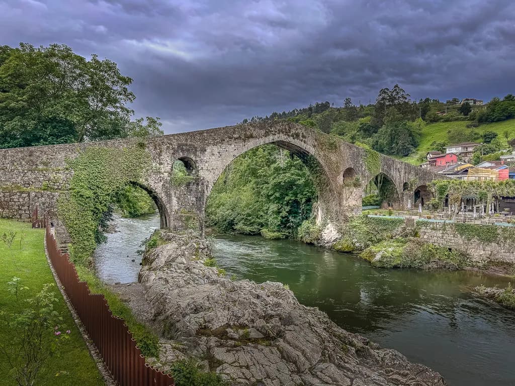 Whispers of the River: A Serene Bridge Embraced by Nature's Touch
