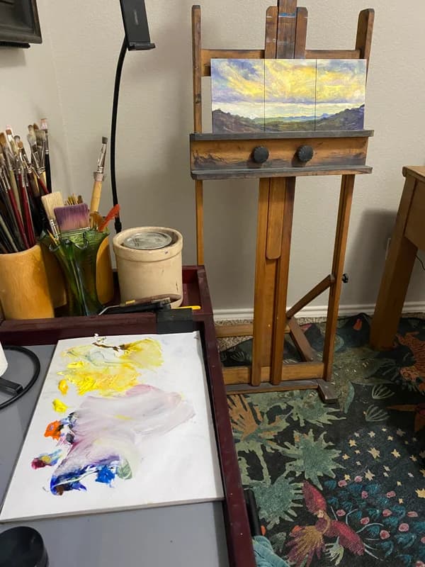 The easel is always ready for me to step up and paint, and the colorful rug is painter-friendly and a wee bit magical.