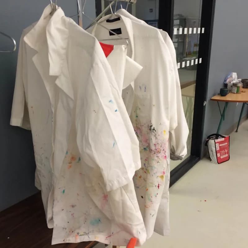 Studio smocks, each with its own history of paint.