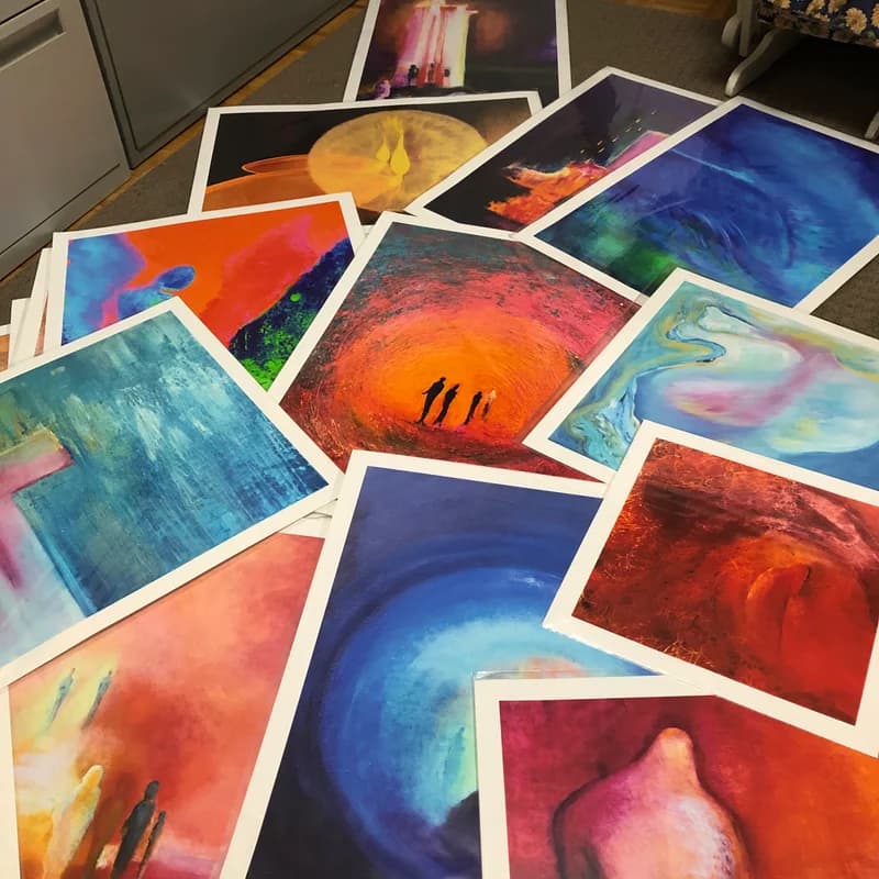 Fine art prints laid out for review.