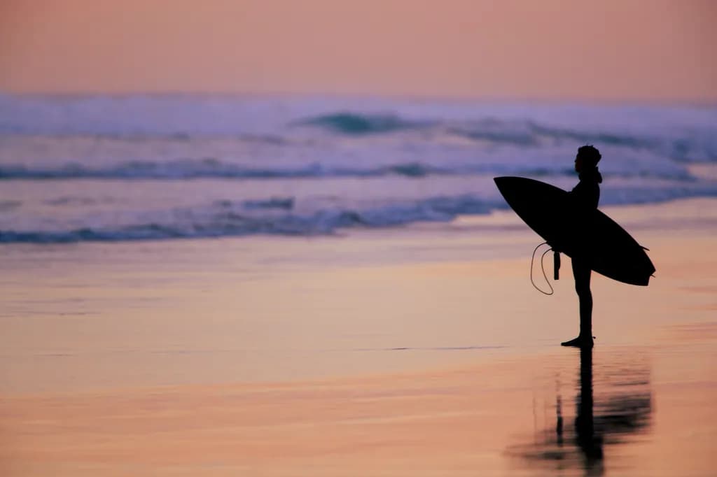 Serenity at Dusk: A Surfer's Reflection on the Shoreline
